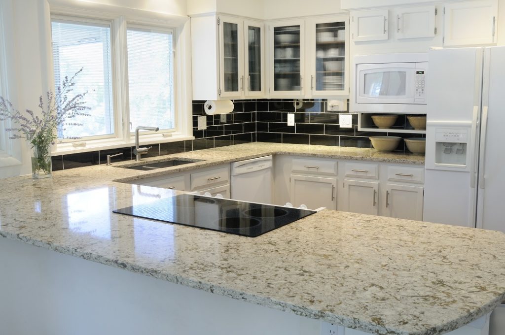 kitchen with brand new quartz countertops in beige and white