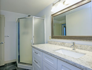 a beautiful granite sink in a bathroom