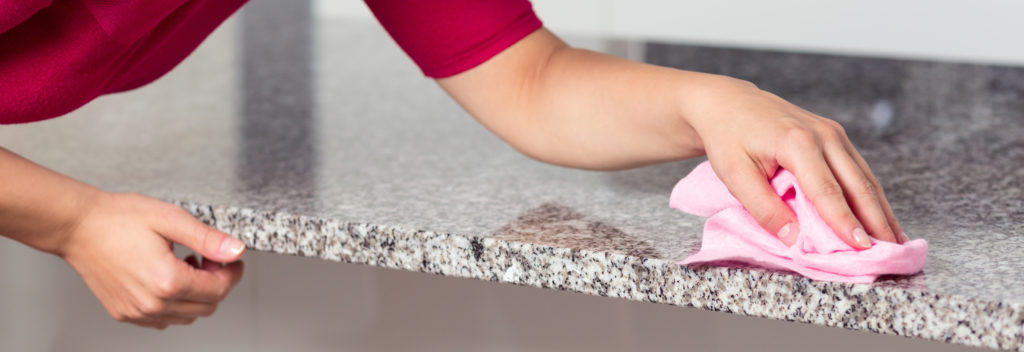 Woman cleaning countertop